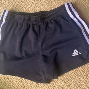 Black and white adidas shorts.